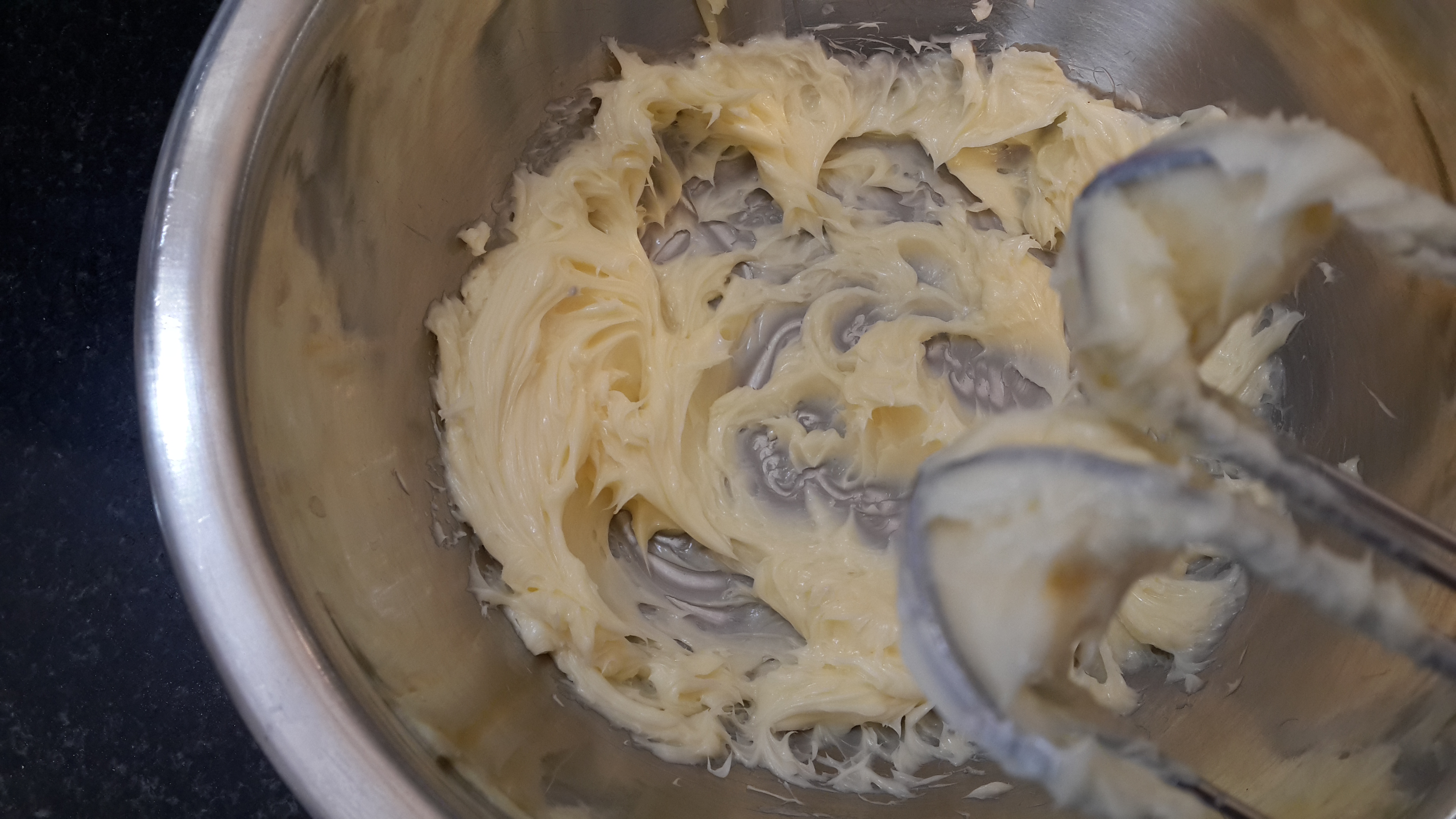 Whisking the butter until soft