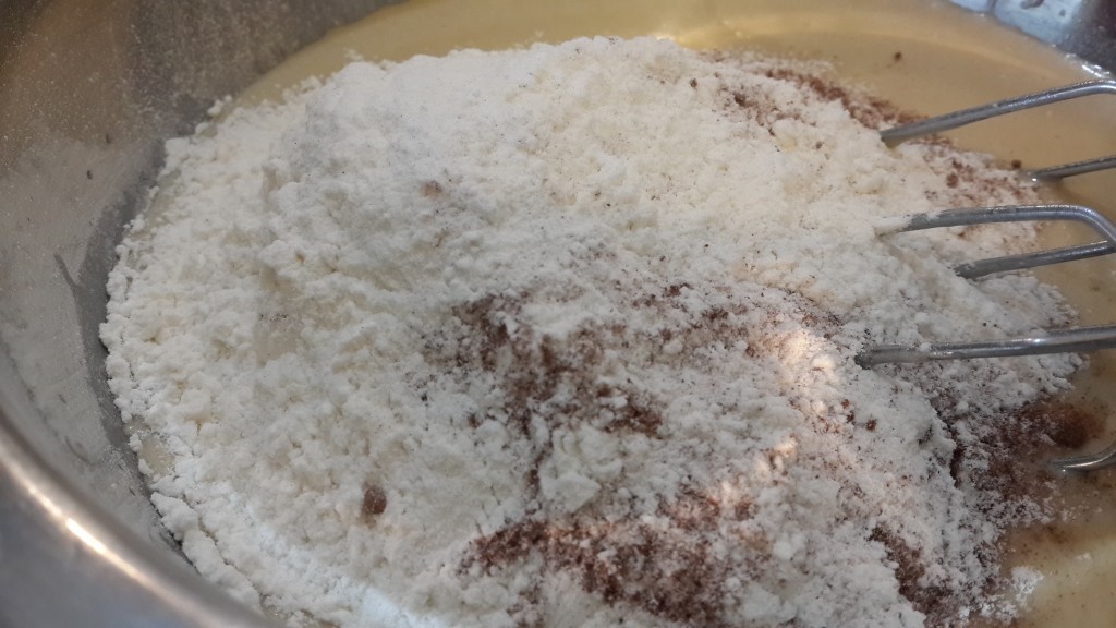 Adding the flour, cinnamon powder and baking powder to the wet ingredients