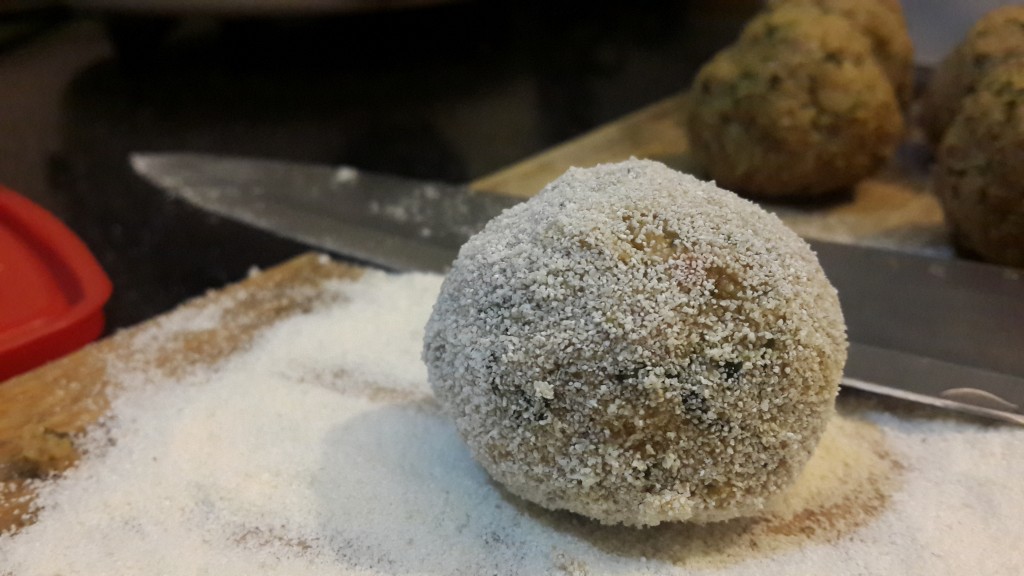 Coating the mince balls with rawa (semolina)/bread crumbs before frying