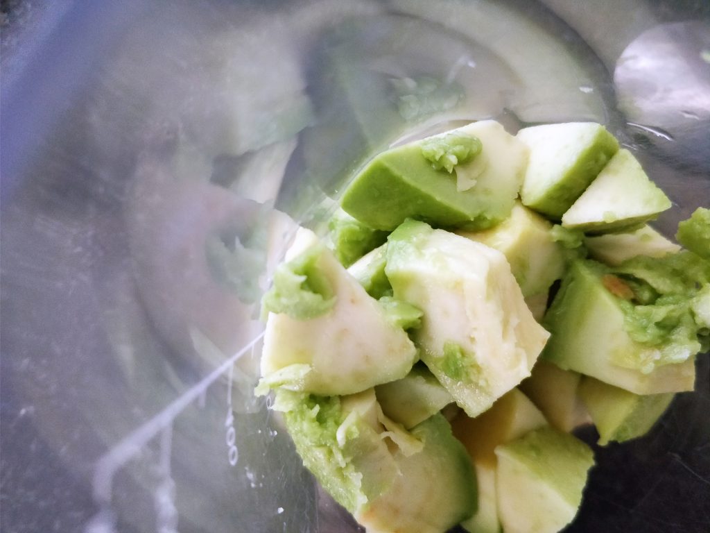 Cubed avocado in a blender