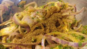 Sliced onions and spices for pakodas or bhajjis